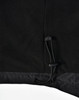 A close-up of the bottom hem of a black unisex jacket featuring a drawstring adjustment.