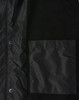 A unisex black jacket featuring a straightforward design and a chest pocket, with a small logo displayed.