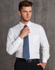 A white long sleeve button-up shirt with a pocket, worn with a blue tie and black trousers. The shirt features a herringbone pattern.