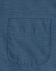 A close-up of a blue men's button-up shirt featuring a pin dot pattern and a pocket.