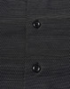 A black button-up shirt featuring a pin dot pattern and two buttons visible on the front. It has a logo.