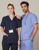 Unisex short sleeve scrub tops in navy and light blue, featuring a pocket and a logo.