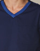 Men's short-sleeve scrub top in navy, featuring a contrast blue neckline and a front pocket. Includes a logo.
