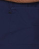 A navy scrub top featuring a large pocket and contrast brown collar. Includes a logo.