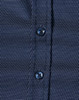 A navy blue button-up shirt with a pin dot pattern and blue buttons. Features a textured fabric design.