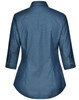 A women's button-up shirt in a blue pin dot pattern, featuring a 3/4 sleeve and a curved hem. It has a logo.