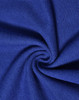 A close-up of textured blue fabric, showcasing the knit pattern of a poly/cotton pique material.