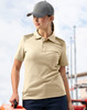 A model wears a beige polo shirt with textured detailing on the shoulders, paired with a grey cap.