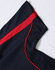 A navy polo shirt with red detailing along the seams and shoulders, featuring a branded logo.
