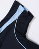 A navy blue kids' polo shirt with light blue accents on the collar and shoulders, featuring a logo.