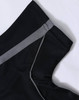 A black polo shirt with grey detailing on the collar and sleeves, featuring a logo.