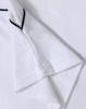 A white polo shirt featuring short sleeves and a mesh texture with contrasting trim. It includes a logo.