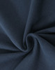 A close-up of navy cotton fabric with a stretch texture, showcasing its softness and weave.