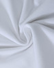 A close-up view of soft, white cotton fabric, showcasing a smooth and stretchy texture.