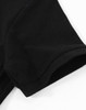 A close-up of a black cotton stretch polo shirt featuring a short sleeve and a rounded hem.