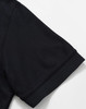 A black polo shirt with a solid design, featuring short sleeves and a classic collar. Includes a logo.