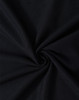 A close-up of black fabric in a swirling pattern, showcasing the texture and weave of the material.