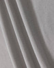 A textured fabric in light grey, showcasing a breathable mesh design suitable for polo shirts.