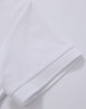 A white polo shirt featuring a textured fabric and a folded sleeve detail. It includes a logo.