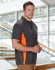 A men's short-sleeve polo shirt in charcoal grey with orange contrast stripes and a logo.