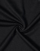 A close-up of black bamboo charcoal fabric with a textured weave, showcasing its soft and breathable quality.