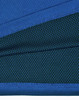 A close-up of a blue and dark green polo shirt featuring a textured fabric and a logo.