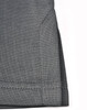 A close-up of the hem of a grey sustainable poly/cotton polo shirt featuring neat stitching and a folded edge.