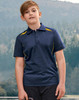 A boy stands outdoors wearing a navy polo shirt with yellow accents and a logo. The background features trees and hills.