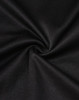 A close-up of black sustainable poly/cotton fabric, showing its smooth texture and stretch ability.