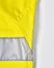 A bright yellow long-sleeved safety shirt with reflective tape and textured panels. It features a logo on the fabric.