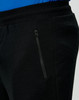 Black poly/cotton terry sweat pants feature a zippered pocket and elastic waistband.