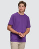 A purple semi-fitted men's cotton t-shirt displayed on a model, featuring short sleeves and a simple design.