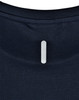 A navy blue lightweight performance T-shirt with a branding logo on the back neck area.