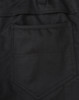 A close-up of black cotton stretch ripstop work pants, featuring a back pocket design and fabric texture.