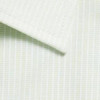 A close-up of a light green shirt with a checkered pattern and a folded collar. It features a logo.