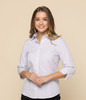 A light grey shirt with three-quarter sleeves and a collar, featuring a logo on the chest.