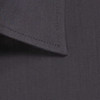 A button-up shirt featuring a textured dark grey fabric and a smooth collar design. It has a logo present.