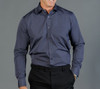 A button-up shirt in dark grey, featuring a pocket and long sleeves, worn by a model against a grey background.