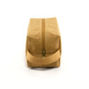 A tan kraft paper cosmetic bag with a zip closure and a side handle. It features a simple design and minimal branding.