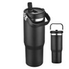 A travel mug in black with a silver rim and a handle, featuring a flip-top lid and a logo.