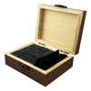 A wooden box containing nine black stone whiskey ice cubes and a velvet pouch, designed for chilling drinks.