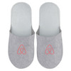 Grey felt slippers featuring a logo on the front, designed for comfort and cosy wear.