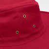 A red wide brim hat featuring gold eyelets for ventilation and a smooth fabric finish.