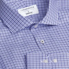 A blue and white check patterned button-up shirt with a collar and buttons, featuring a logo label inside.