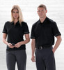 A black Dri Gear Matrix polo shirt for men and women, featuring contrasting accents and a logo.