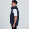 A navy puffa vest shown from the side, featuring a high collar and a logo on the front.