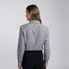 A women's button-up shirt in light grey with long sleeves and a collar, featuring a logo on the back.