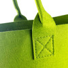 Green felt tote bag with sturdy handles and visible stitching detail. Features a simple, modern design.