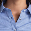 A close-up of a women's button-up shirt in blue with a checkered pattern, featuring a collar and buttons.