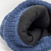A blue beanie with a soft black lining, featuring a textured knit pattern and a logo.